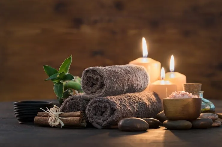 Brown towels with bamboo candles relax spa massage